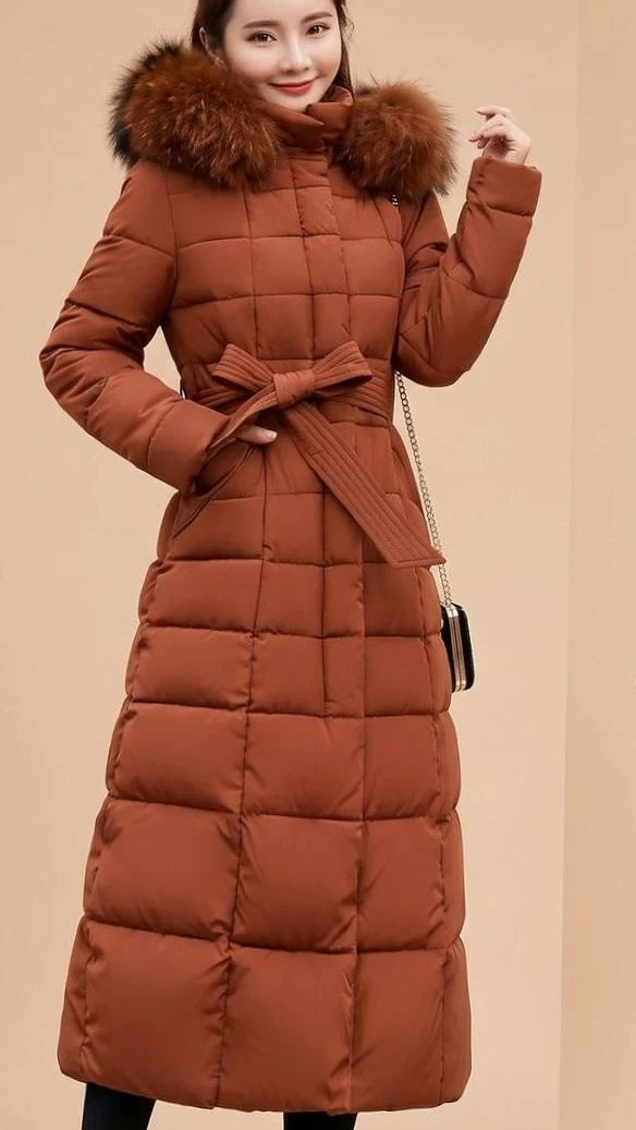 Emilia long quilted winter coat with faux fur trimmed hood in champagne, front view on model