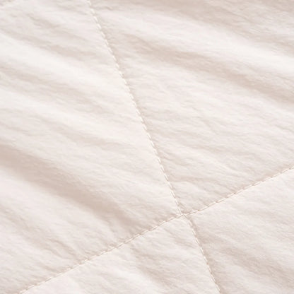 Elin puffer jacket in beige, close-up of the fabric detail, second view