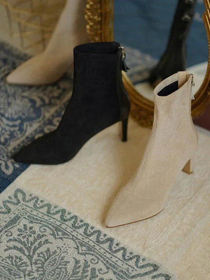 Woman wearing Juno apricot sock boots, seated, side angle