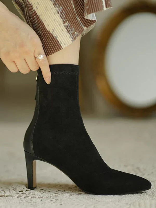 Woman wearing Juno black sock boots, close crop