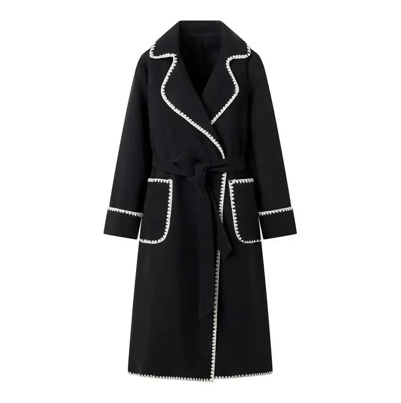 Woman wearing Kendall trench coat in black, front view, close crop