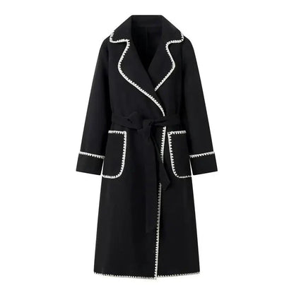 Woman wearing Kendall trench coat in black, front view, close crop