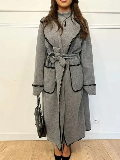 Woman wearing Kendall trench coat in green, front view, close crop