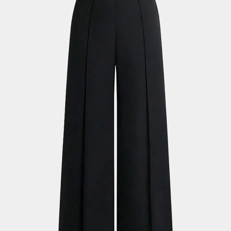 Nova wide-leg pants in black, close-up front view of the pleated waist