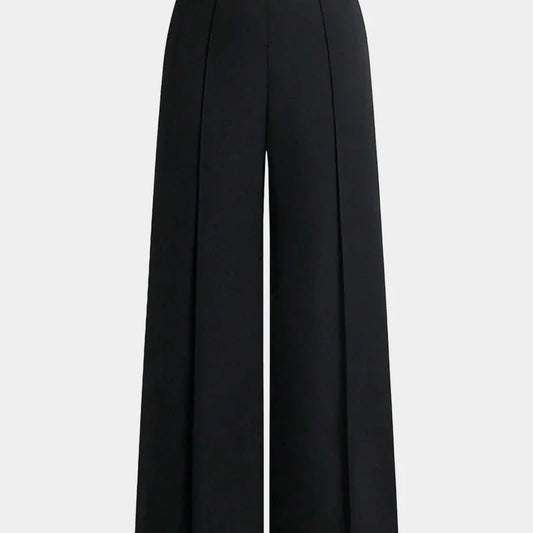 Nova wide-leg pants in black, close-up front view of the pleated waist