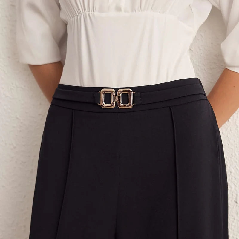 Nova black wide-leg pants, back view of the belted waist detail