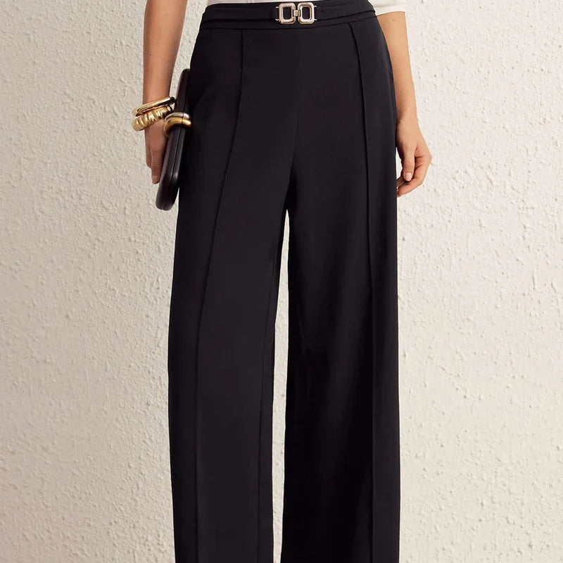 Nova black wide-leg pants, front view of the belted waist detail