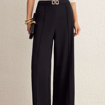 Nova black wide-leg pants, front view of the belted waist detail