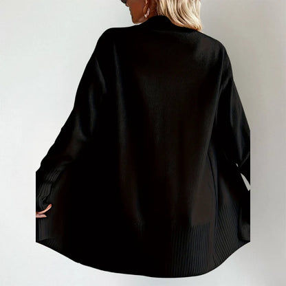 Woman wearing Talia cardigan in black, back view