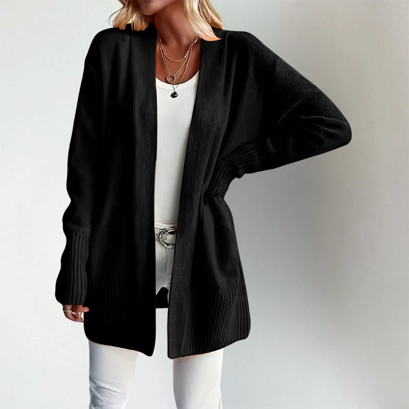 Woman wearing Talia cardigan in black, front view