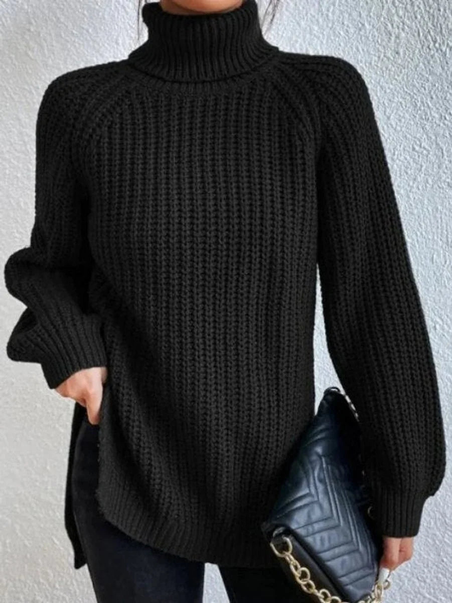 Amelie oversized chunky knit turtleneck sweater in black, front view on model