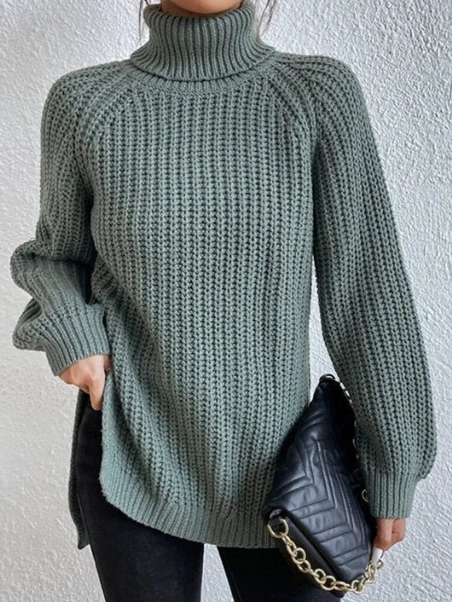 Amelie oversized chunky knit turtleneck sweater in green, front view on model
