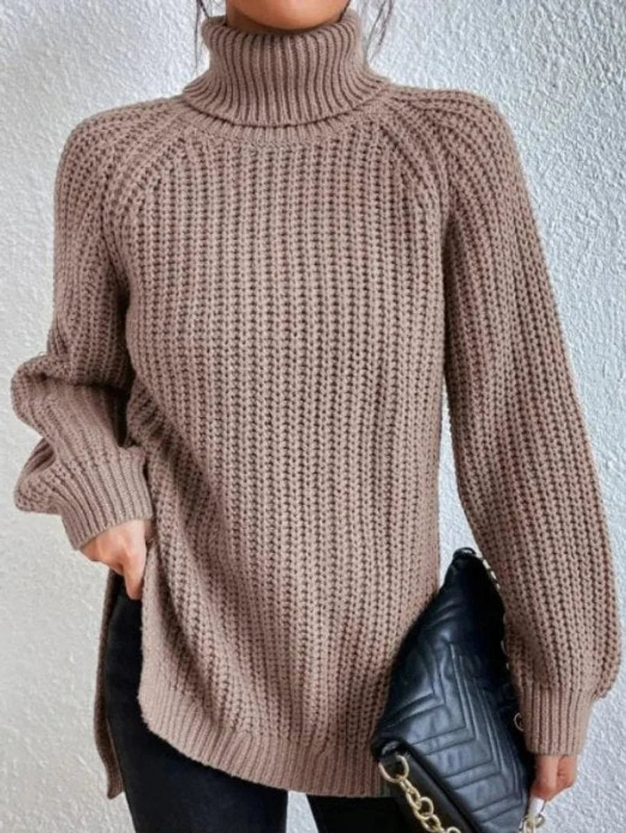 Amelie oversized chunky knit turtleneck sweater in light brown, front view on model