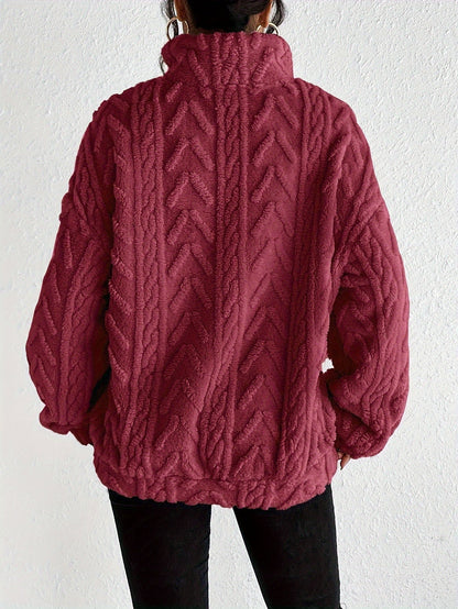 Women's cable-knit zip-neck sweater in burgundy, back view