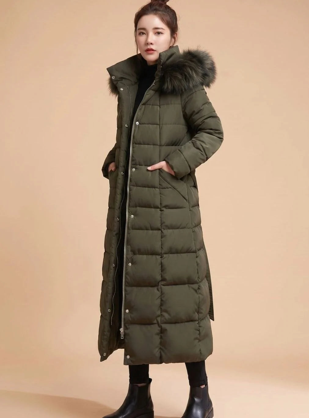 Emilia long quilted winter coat with faux fur trimmed hood in army green, second front view on model