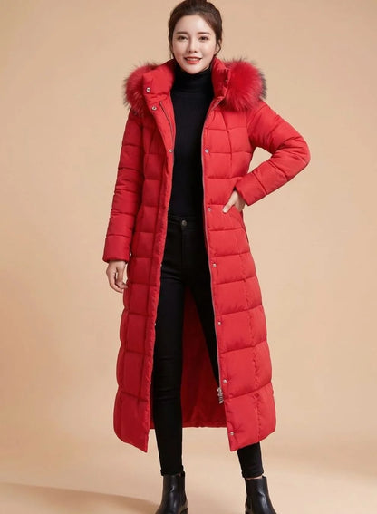 Emilia long quilted winter coat with faux fur trimmed hood in red, front view on model