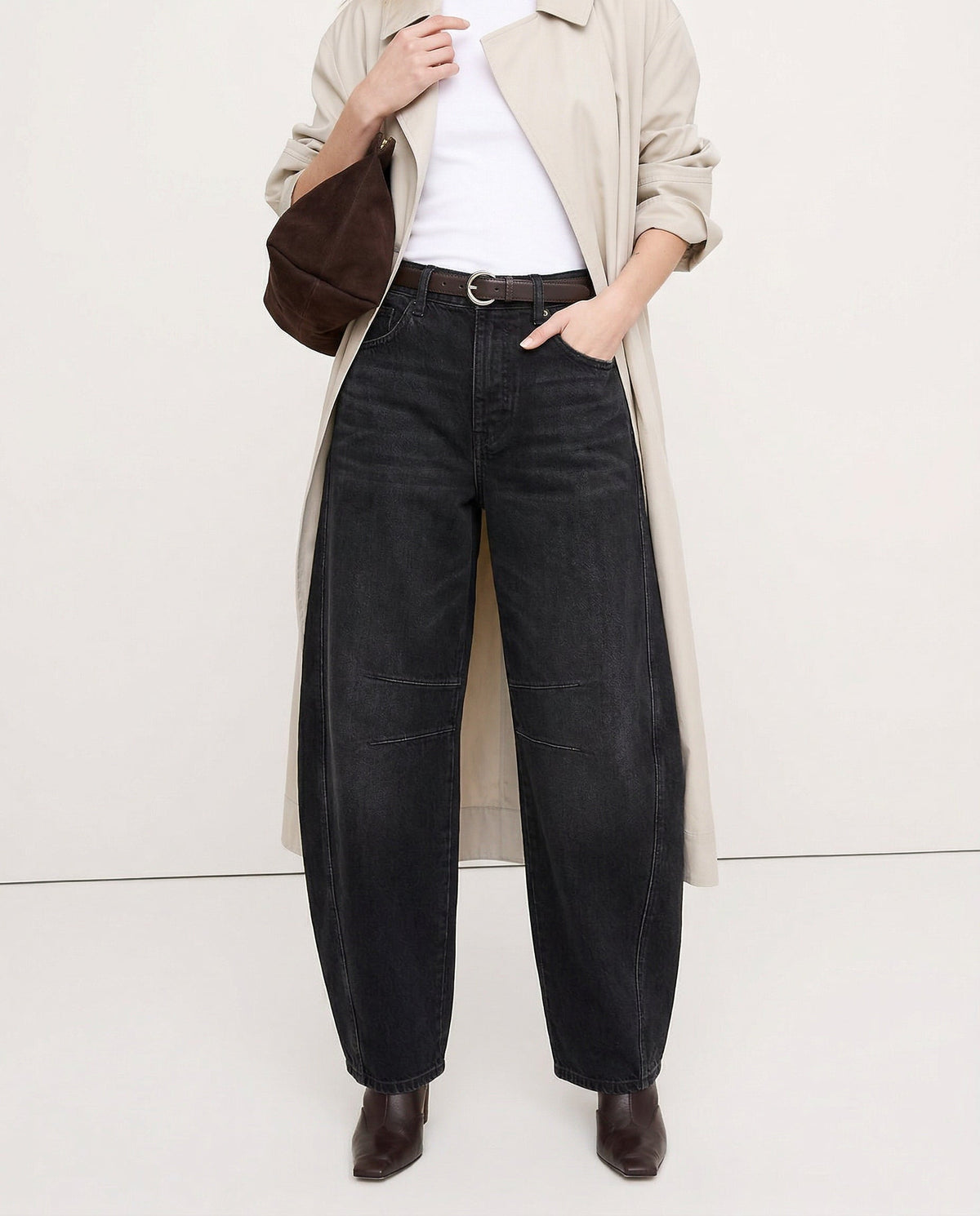 Everly black barrel-leg jeans, styled with handbag