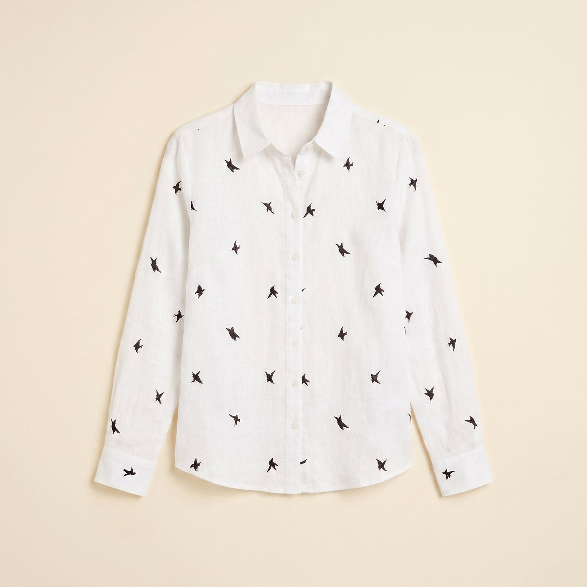 Flora cotton-linen blouse in white bird print, flat lay view