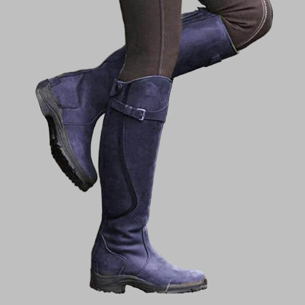 Greta leather orthopedic boots in blue, side view on model