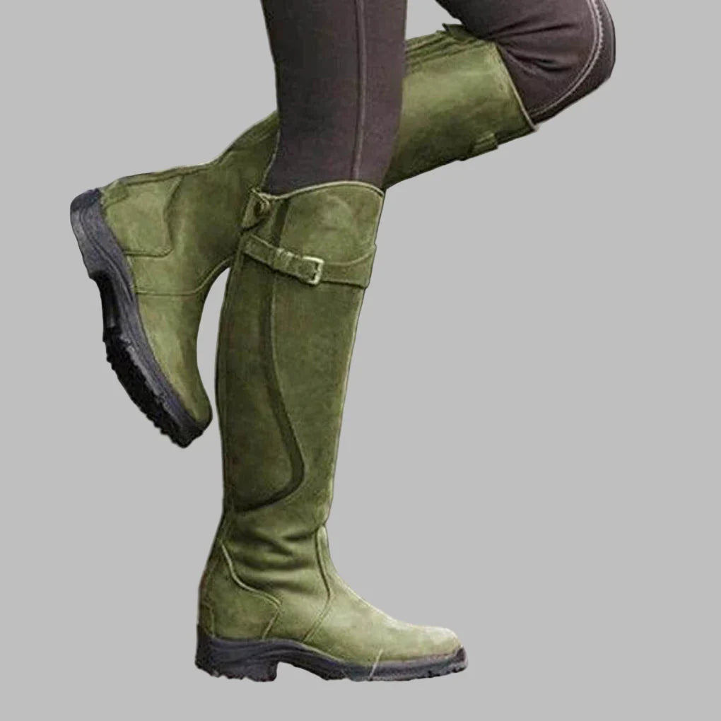 Greta leather orthopedic boots in green, side view on model