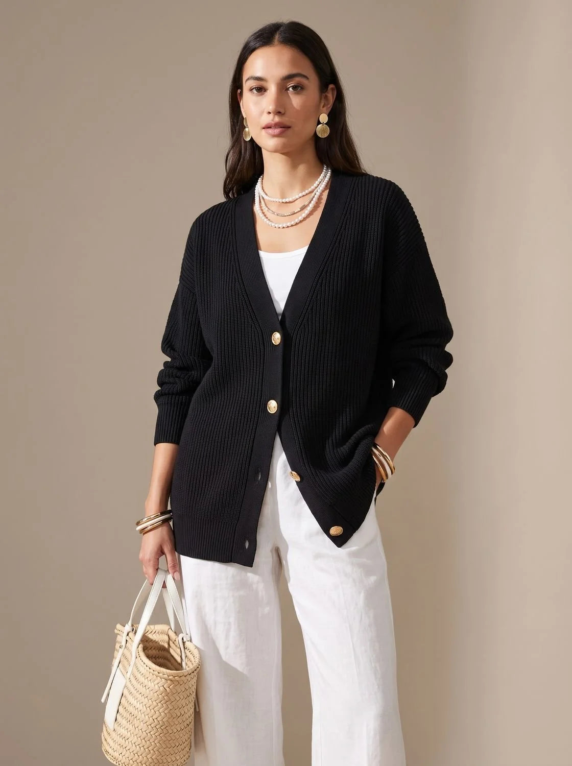 Victoria oversized knit cardigan in black, front view on model