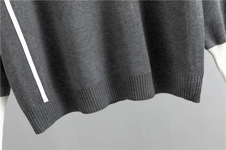 Grey knit sweater ribbed hem detail