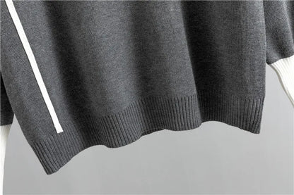 Grey knit sweater ribbed hem detail