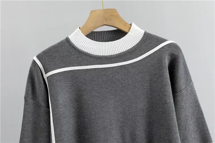 Grey colorblock knit sweater on hanger