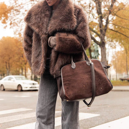 Brown faux fur jacket styled with jeans, street view