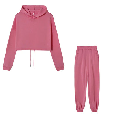 Pink cropped hoodie and joggers set, flat lay