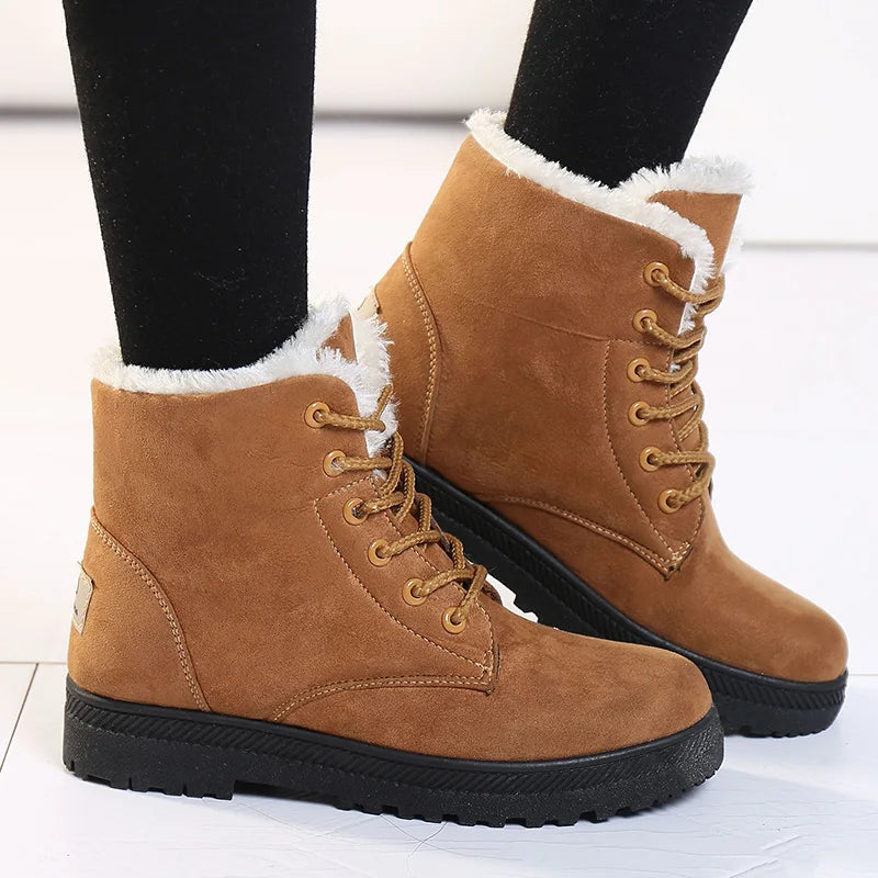 Women's brown fleece-lined lace-up ankle boots with platform sole, worn view