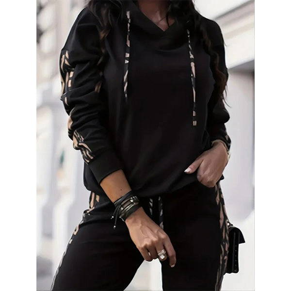 Women's black hoodie tracksuit set with drawstring pants, front view