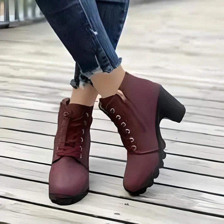 Red lace-up ankle boots with side zip, side view