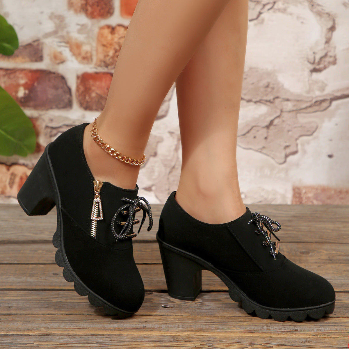 Black lace-up block heel ankle boots, worn view