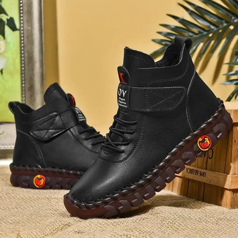 Black mid-top ankle boots with padded collar, pair view