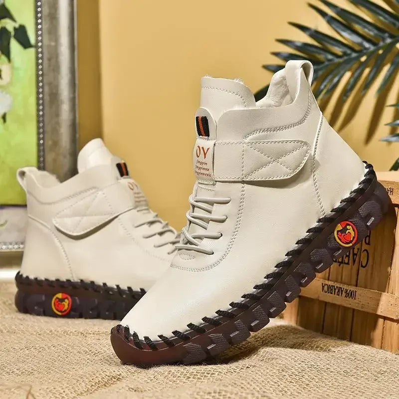 Women's white lace-up mid-top ankle boots with stitched rubber sole, side view