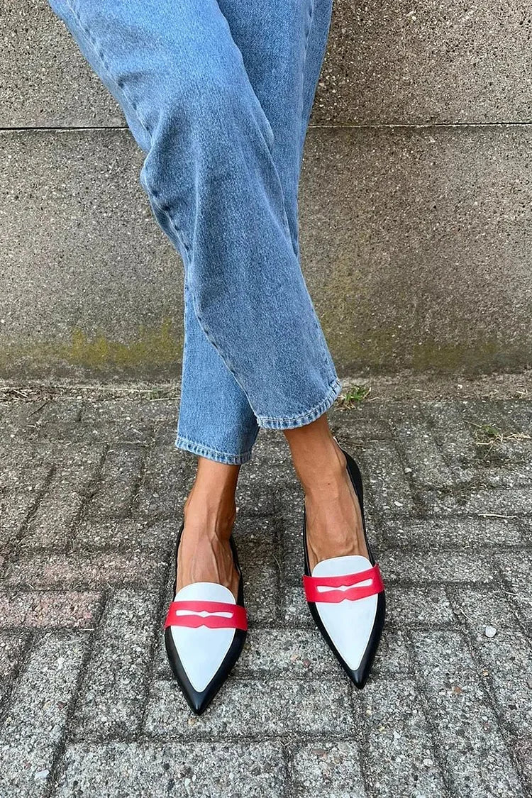 Two-tone pointed toe slip-on flats styled with jeans