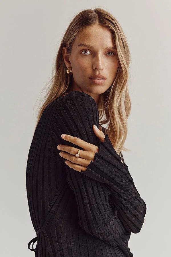 Black ribbed knit maxi dress, close-up view