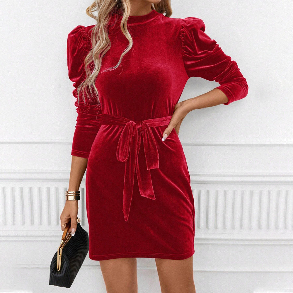Red velvet bodycon mini dress with tie belt, side view
